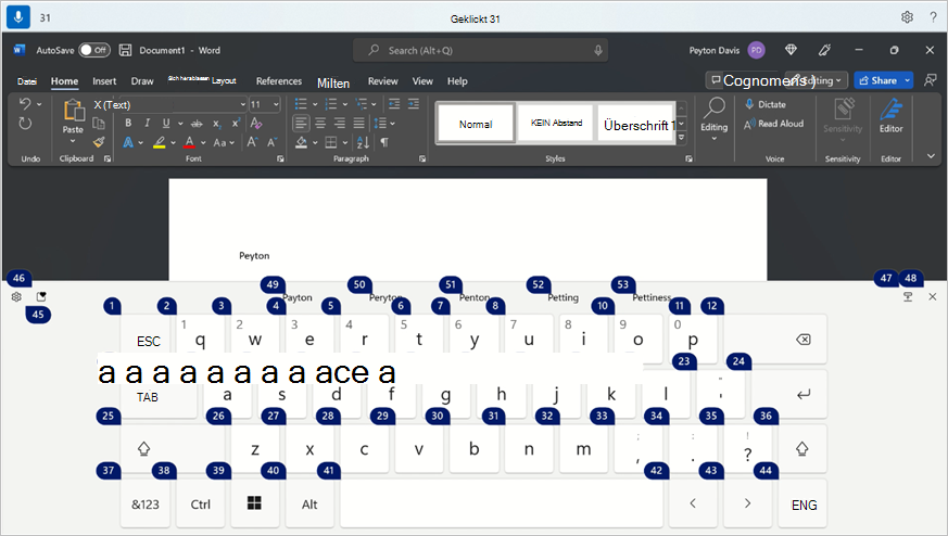 Die Windows-Bildschirmtastatur zeigt die Emoji-Schaltfläche mit der Überlagerung der Sprachzugriffsnummer an.