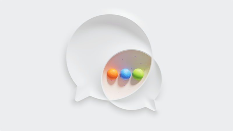 Illustration of two overlapping chat bubbles holding orange, blue, and green spheres.