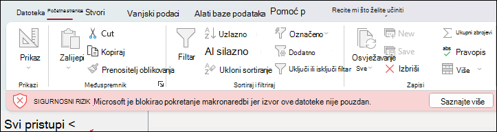 Poruka o sigurnosnom riziku prikazana ispod vrpce u bazi podataka programa Access s gumbom Saznajte više