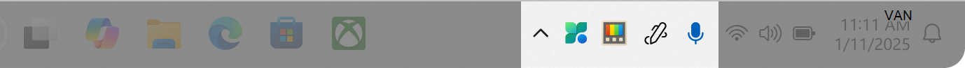 Screenshot of the Windows taskbar with some icons in the system tray area.