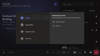 Antarmuka rapat Microsoft Teams dengan detail peserta. Menu kustomisasi tampilan terbuka, menawarkan galeri, galeri besar, dan tata letak baris depan.