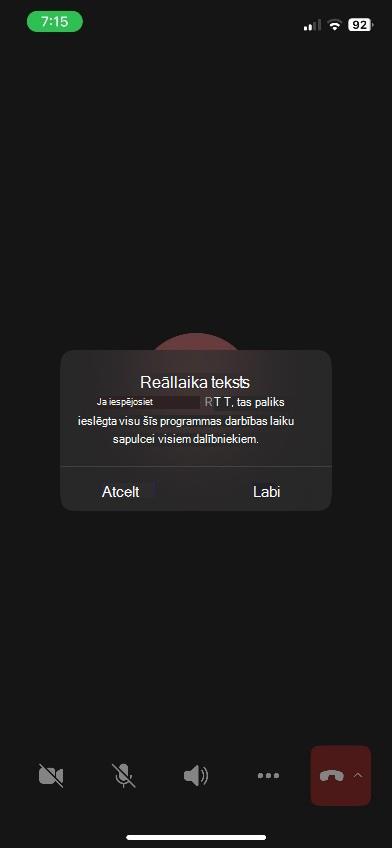 Teams sapulces logs ar RTT paneli iOS ierīces apakšā.