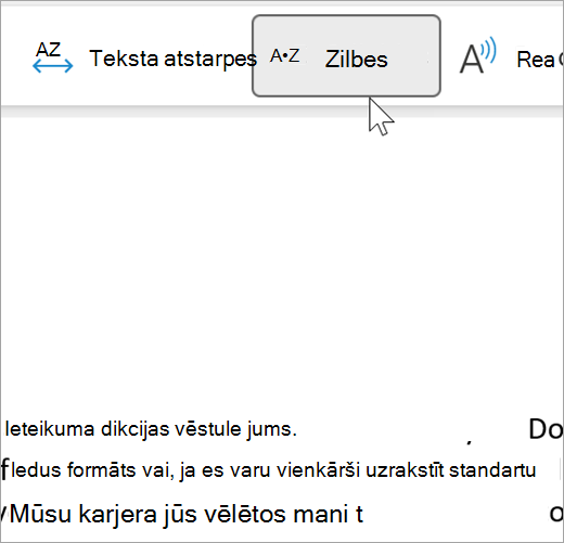 Ekrānuzņēmums ar atlasītu tīrskata lasītāja zilbju līdzekli, kurā redzami daži vārdi e-pasta ziņojumā, kas atdalīti zilbēs. Vārds ieteikums tiek rādīts kā rec dot om dot men dot da dot tion