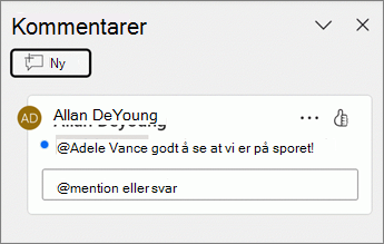 En blå prikk vises ved siden av en kommentar i kommentarruten.