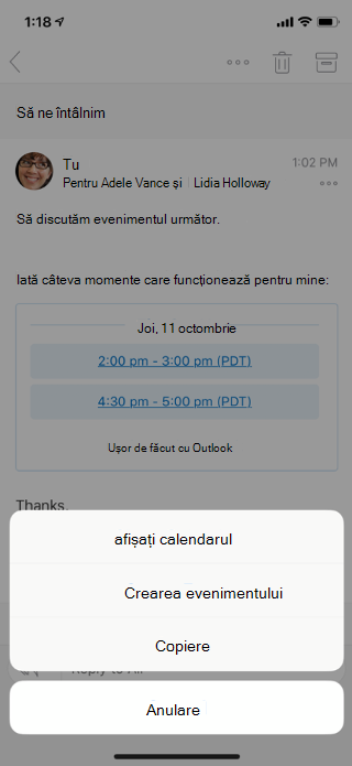 Afișează un mesaj de e-mail pe un ecran mobil. Există opțiuni de meniu în partea de jos: Afișare Calendar, Creare eveniment, Copiere și Anulare.