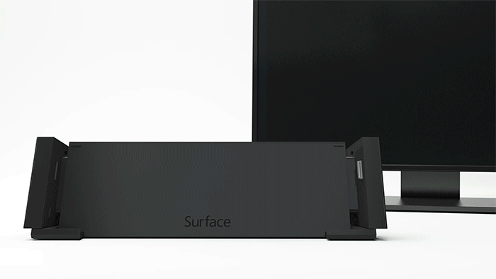 Animovaný obrázok zobrazuje zariadenie Surface, ktoré sa posúva nadol do doku, a monitor za dokom, ktorý sa zapína, aby sa zobrazil rovnaký obraz ako na zariadení Surface