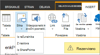 Gumb »Vstavi sliko« z menijem možnosti vira spodaj.