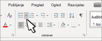 Označena puščica navzdol oznak v skupini »Odstavek«.