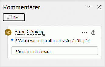 En blå punkt visas bredvid en kommentar i fönstret Kommentarer.